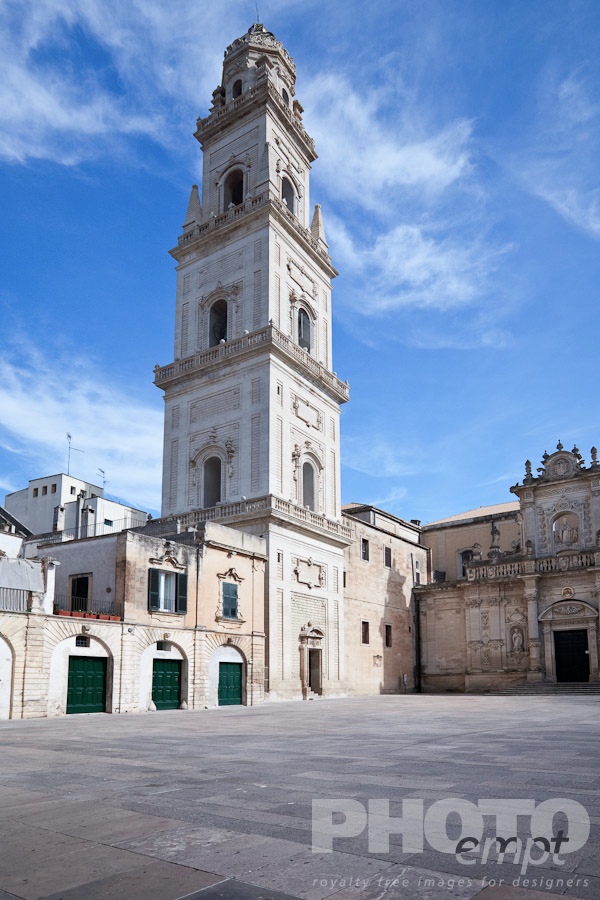 Italy South - Puglia. . . . . Piazza del Duomo, with view of campanile (bell tower) and Baroque ornamentation of Cathedral, sunny spring morning with blue sky, Lecce, Salento, Puglia, Southern Italy