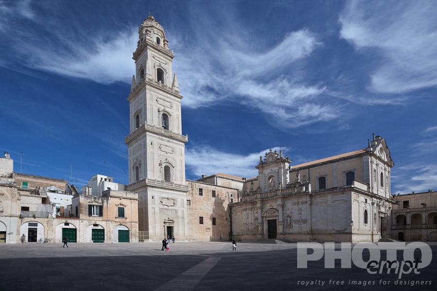 Italy South - Puglia. . . . . Piazza del Duomo, with view of campanile (bell tower) and Baroque ornamentation of Cathedral, sunny spring morning with blue sky, Lecce, Salento, Puglia, Southern Italy