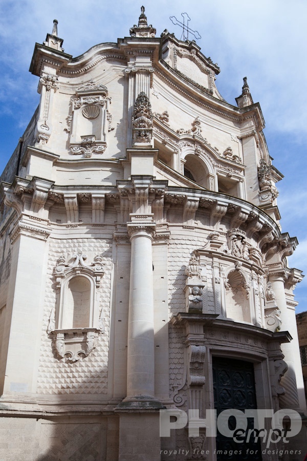 Italy South - Puglia. . . . . Close up of facade, church of San Matteo,  Baroque ornamentation and doorway, sunny spring morning with blue sky, Lecce, Salento, Puglia, Southern Italy