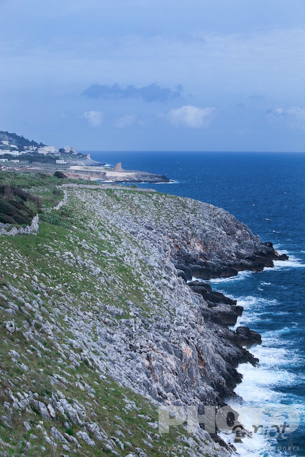 Italy South - Puglia. . . . . Coastline on sunny afternoon with storm threatened, rocky cliffs, row of 16th century defense towers along shoreline, Santa Cesarea Terme, , Salento, Puglia, Southern Italy