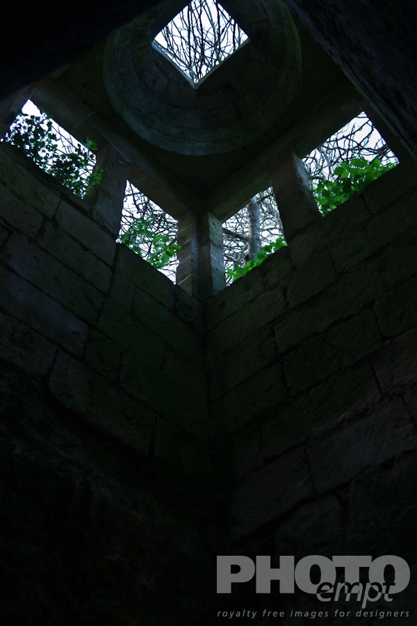 Italy South - Puglia. . . . . Tower as seen from below, underground cavern lit from above, used for oil production and storage, monastery ruin, Salento, Puglia, Southern Italy