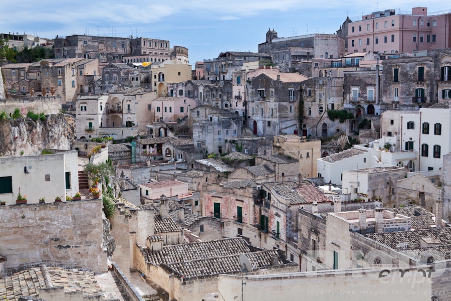 Italy South - Puglia. . . . . Aerial view of ancient town of Matera with tufa houses, sunny spring afternoon with blue sky, Puglia, Southern Italy
